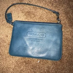 Turquoise/Teal wristlet by Coach